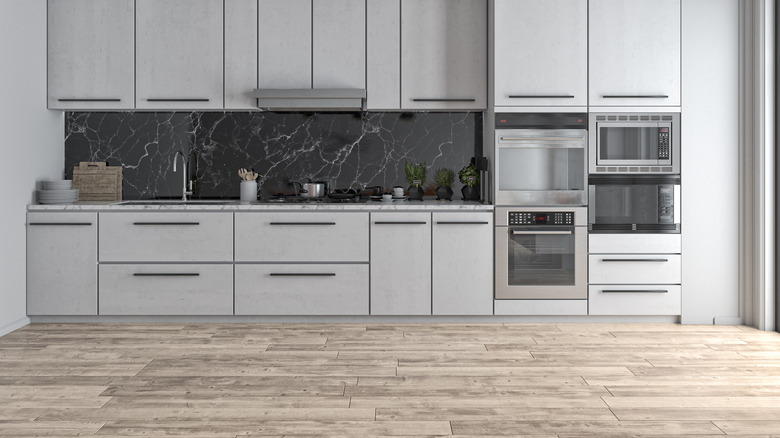 kitchen with vinyl wallpaper backsplash