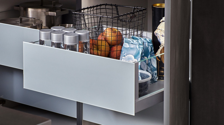 kitchen drawers with water bottles