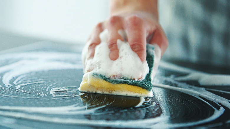 sudsy sponge on stove top