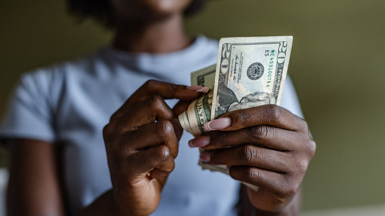 Person counting money