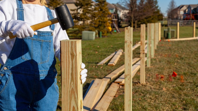 installing fence posts in yard