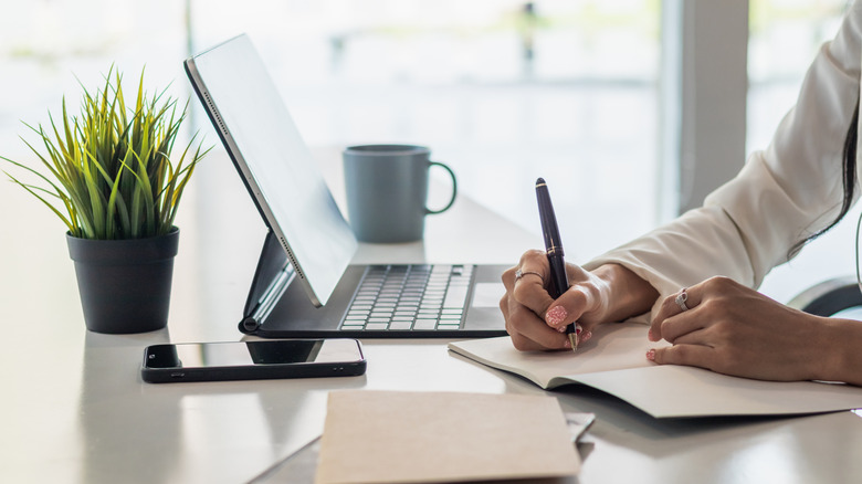 Person working at their home office desk