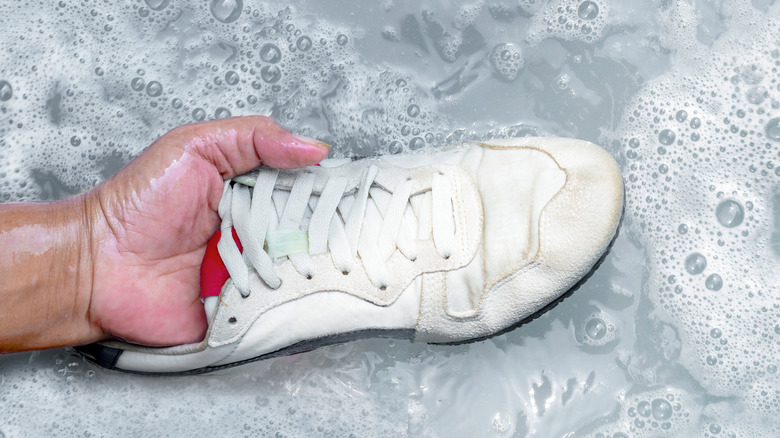 Shoes in soapy water