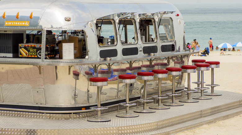 An Airstream diner on a beach 