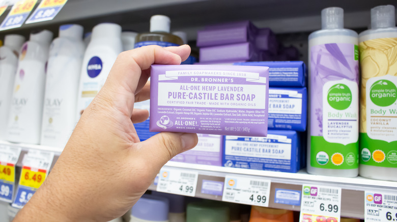 Hand holding bar of Dr. Bronner's soup