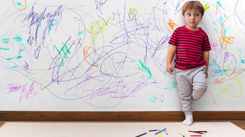 colorful crayon on white wall