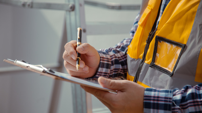 contractor with a clipboard