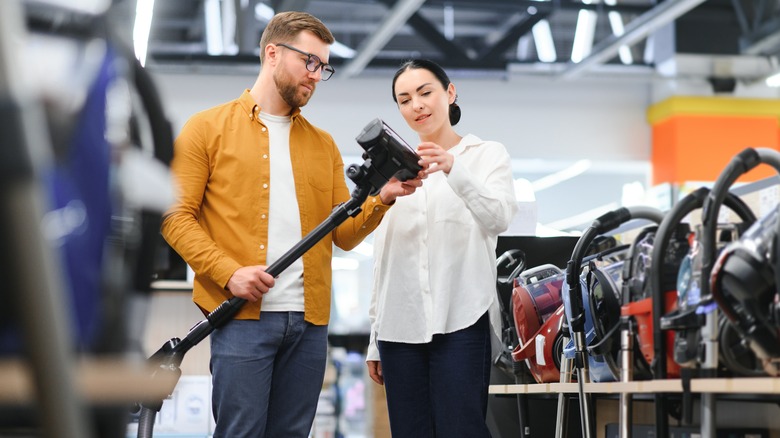 Couple shopping for vacuum