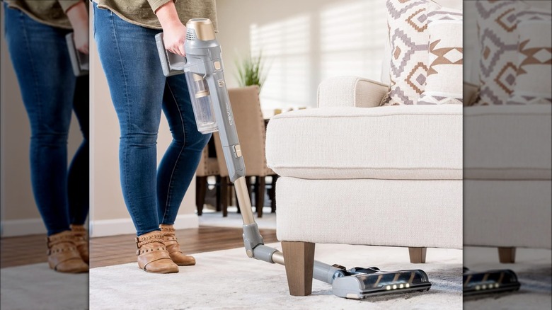 Woman using Kenmore vacuum