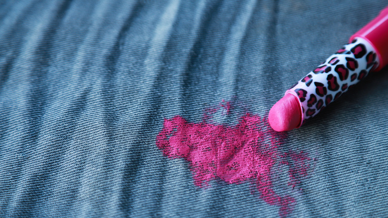 woman cleans stained shirt