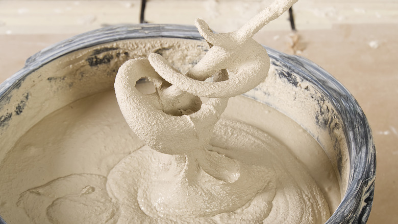 mixing plaster in a bucket