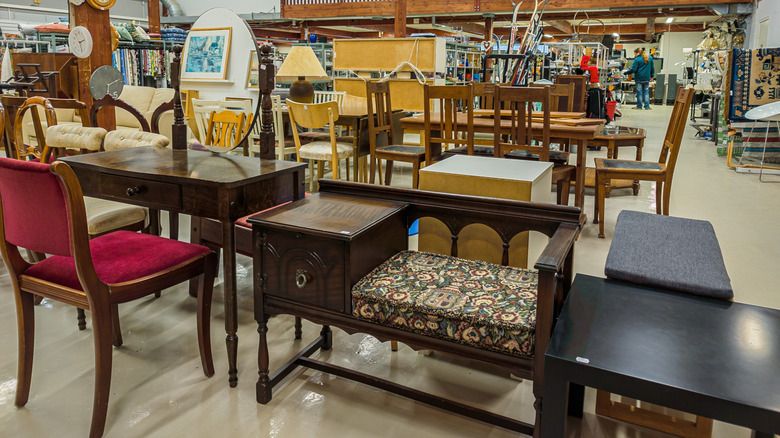 Furniture pieces on the floor of vintage furniture store