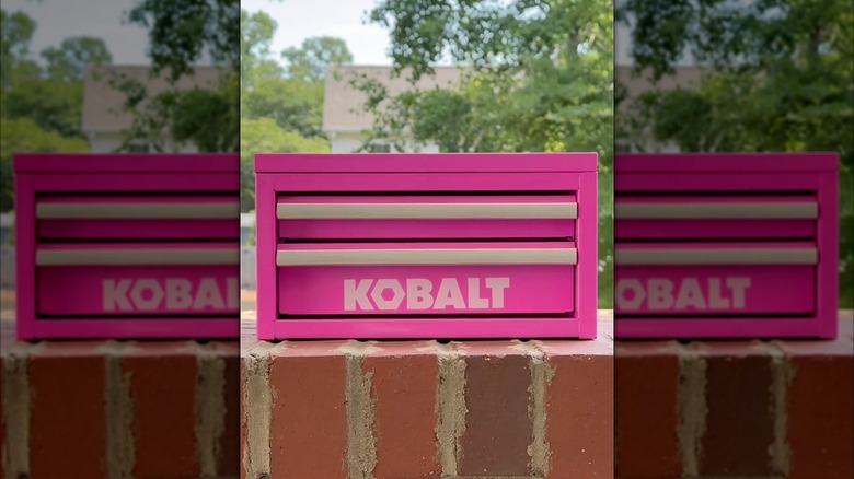 Kobalt hot pink mini toolbox on a brick wall