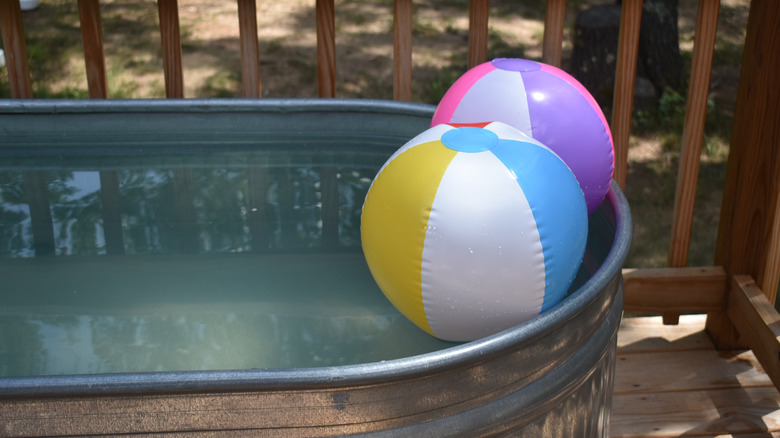 two beach balls in pool