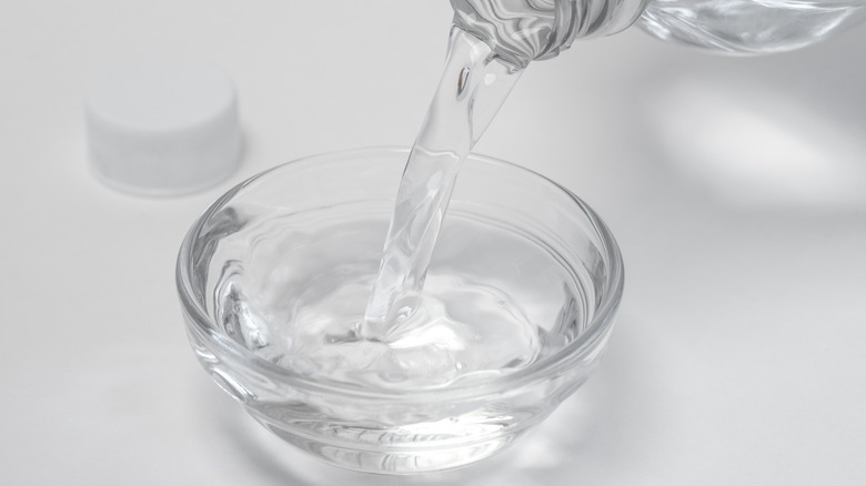 Pouring vinegar into bowl