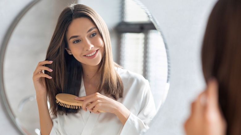 Woman brushing hair