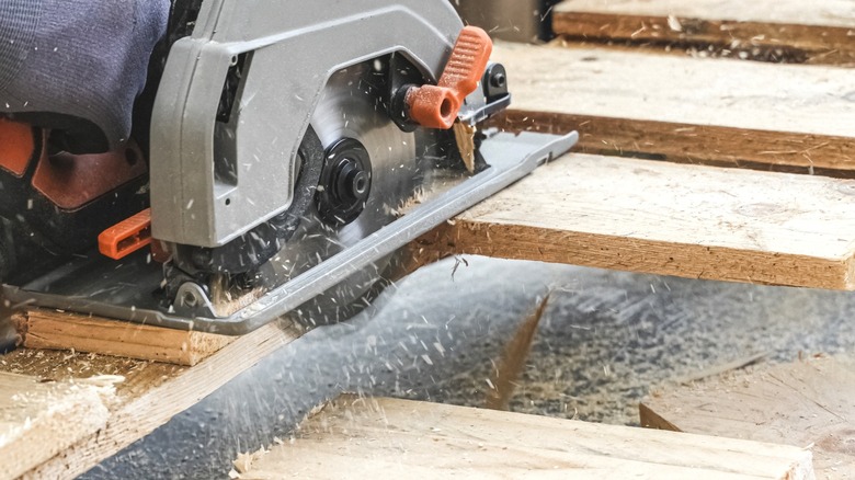 circular saw cutting pallet deck