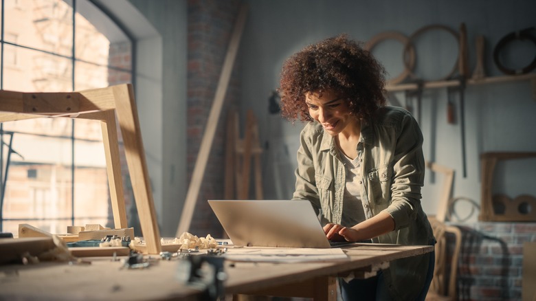 Carpenter using laptop