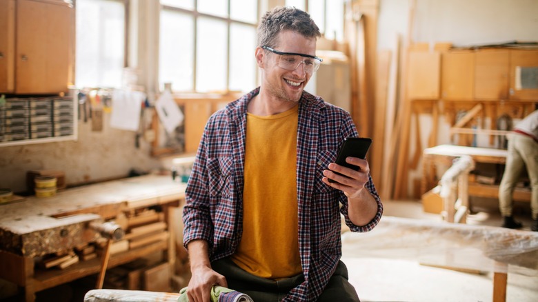 Carpenter using phone