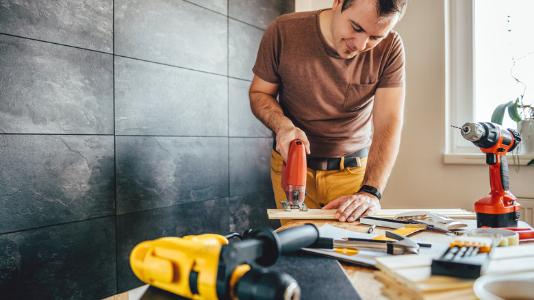 Carpenter working in lit room