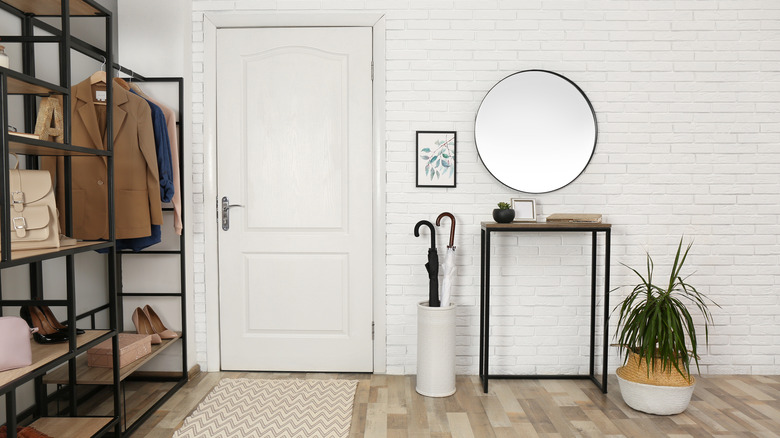 Foyer with mirror and rug