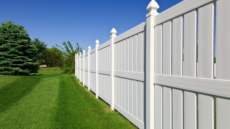 Vinyl fence around a lawn