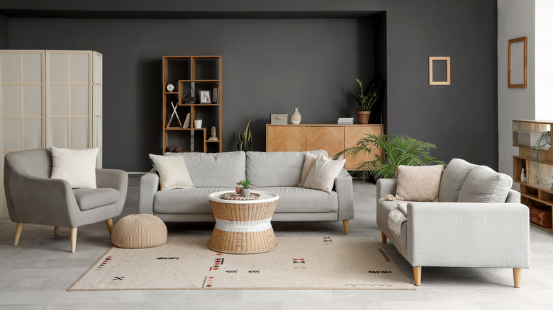 A living room with charcoal gray walls