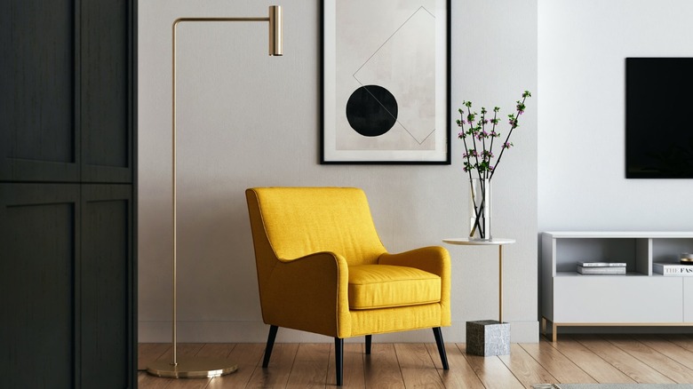 Yellow chair in grey room