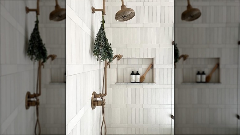 Beautiful shower with off white ceramic tiles on the walls