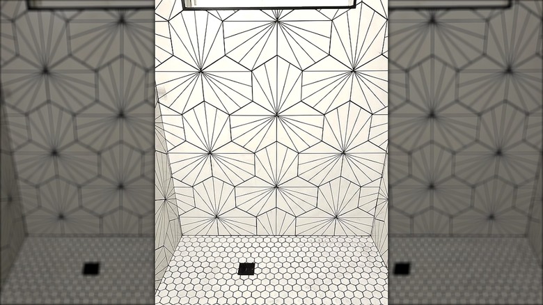 White shower with unique white porcelain mosaic tile in a hex pattern for the flooring