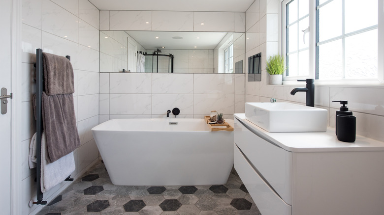 White bathroom with geometric tile flooring