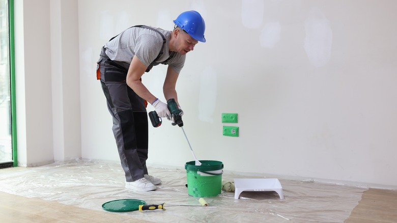 Man mixing paint