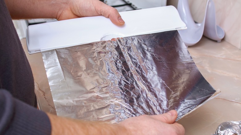 man using aluminum foil