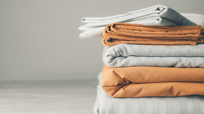 folded bedsheets in stack