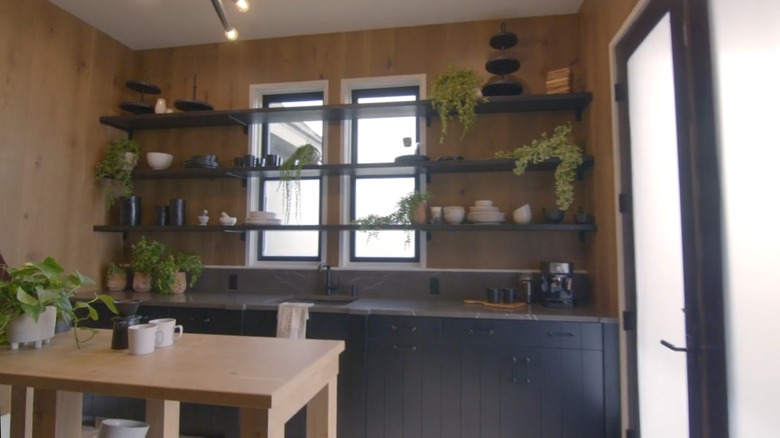 A second, hidden kitchen with dark colors