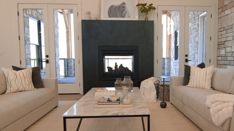 Room from Rock the Block with a dual-sided fireplace