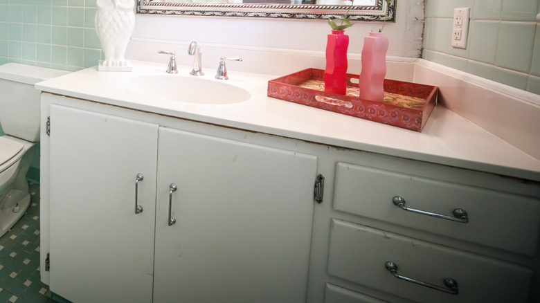 light blue-green painted bathroom vanity