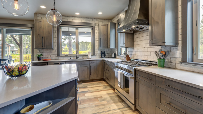 taupe kitchen cabinets white tiles