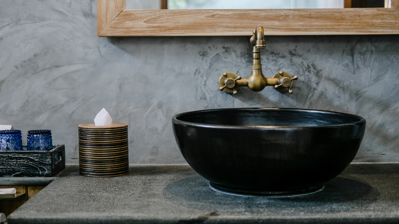 black bowl sink in bathroom