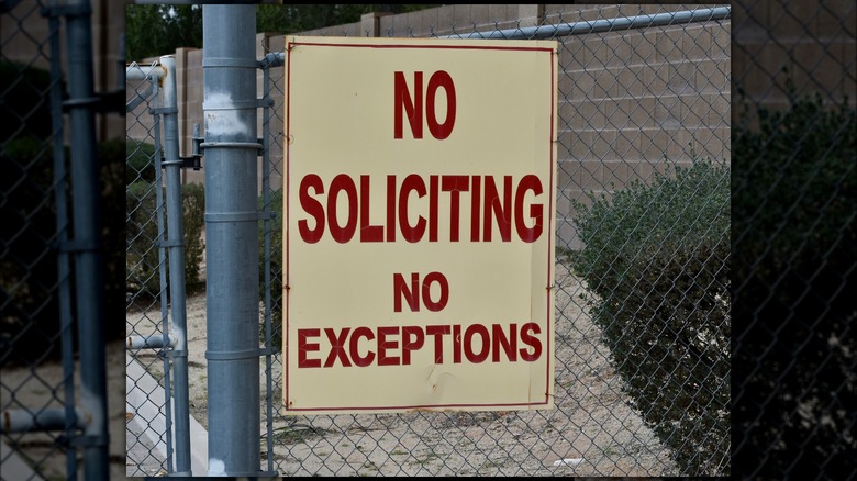 Clear no soliciting board