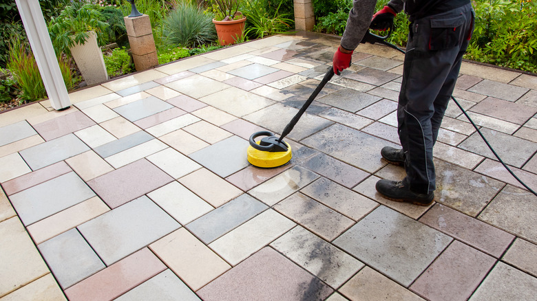 scrubbing patio with vinegar