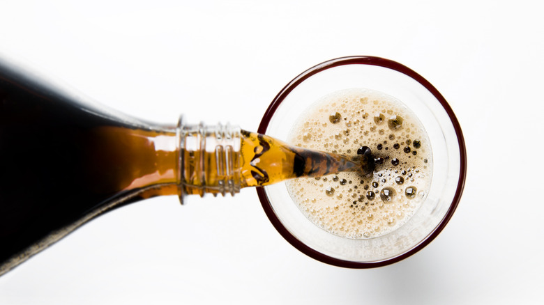 Pouring cola into glass