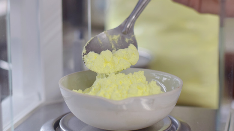 Sulfur powder in spoon