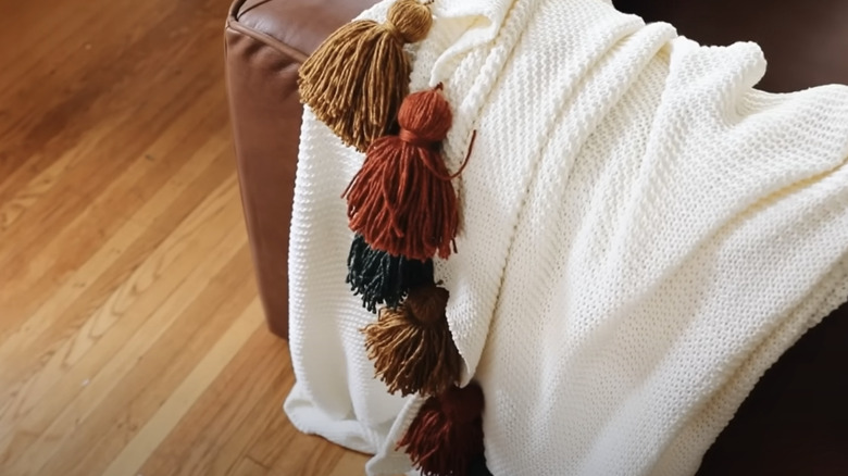 Homemade tassels on IKEA blanket