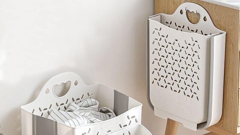 white plastic hanging laundry hamper