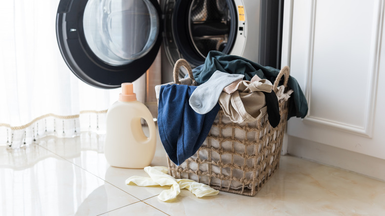 laundry basket by laundry machine