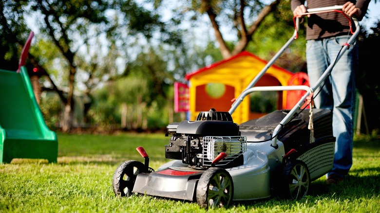 Close-up of lawn mower moving