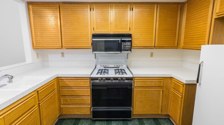 Outdated oak kitchen cabinets