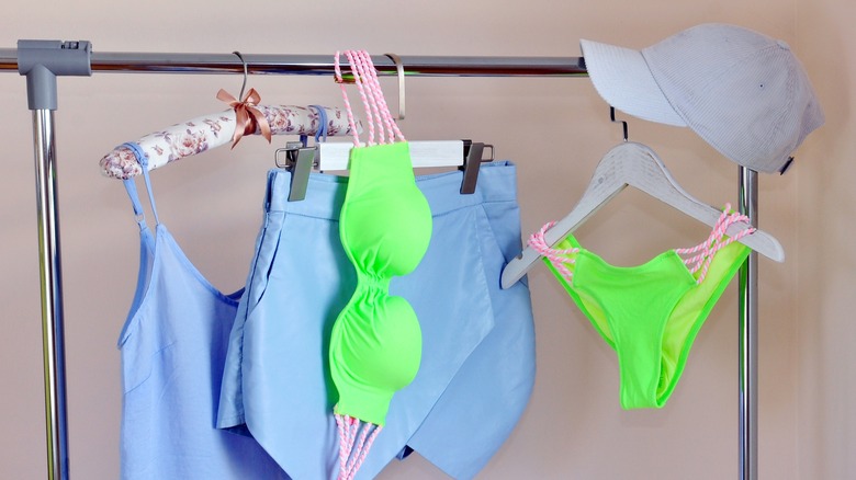 swimsuits hanging on rack
