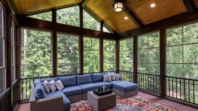 screened-in porch with seating